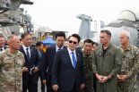 尹 탑승했던 그 항공모함…드론 띄워 ‘불법촬영’한 中 유학생 2명 구속