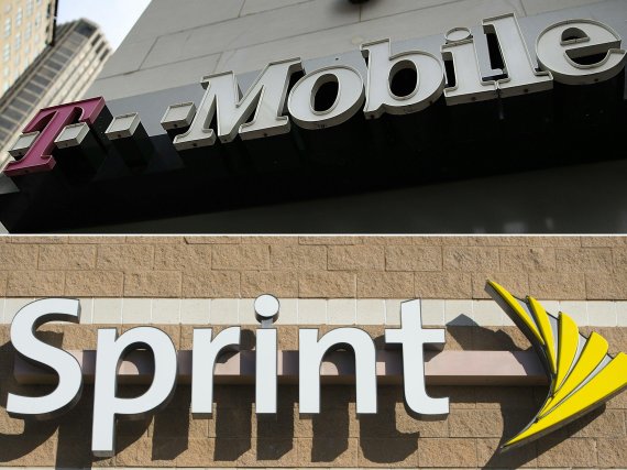 (COMBO/FILES) This combination of file pictures created on October 30, 2017 shows the T-Mobile logo in a April 24, 2017, file photo in San Francisco, California; and a Sprint cell phone company logoin New Carrollton, Maryland, in a December 31, 2014, file photo. US wireless operators Sprint and T-Mo
