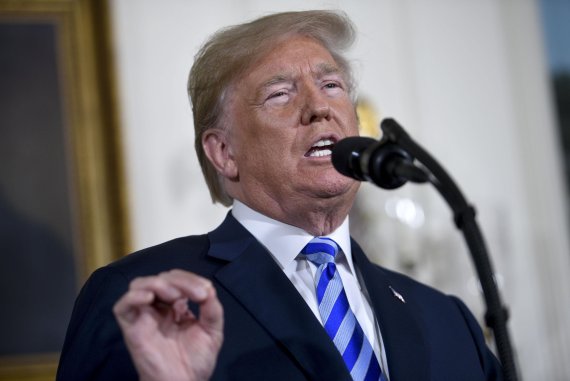 President Donald Trump announces his decision to end the United States participation in the Joint Comprehensive Plan of Action (JCPOA) with Iran and his plans re-impose sanctions lifted under the deal in the Diplomatic Room of White House in Washington, D.C on May 8, 2018. Photo by Leigh Vogel/UPI<A