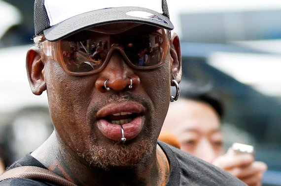FILE PHOTO: Former NBA basketball player Dennis Rodman leaves Beijing airport after arriving from North Korea's Pyongyang, China, June 17, 2017. REUTERS/Thomas Peter/File Photo <All rights reserved by Yonhap News Agency>