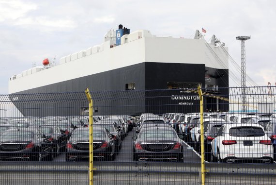 (FILE) - Cars of German car maker Mercedes Benz are parked at the automotive terminal at the port of Bremerhaven, northern Germany, 23 July 2017. (issued 22 June 2018). US President Donald J. Trump sent out a tweet threatening a 20 percent tariff on cars imported from Europe. German auto stocks fell