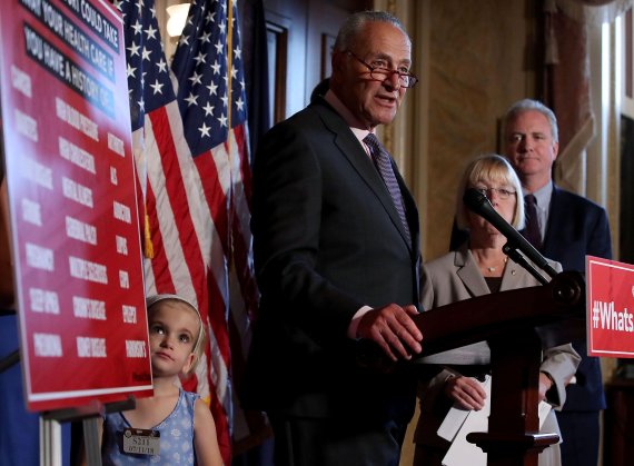 WASHINGTON, DC - JULY 11: Senate Minority Leader Chuck Schumer (D-NY) speaks about healthcare while flanked by 6 yo Charlie Wood who has complex medical needs from being born 3 months early, during a news conference on Capitol Hill, on July 11, 2018 in Washington, DC. Schumer urged Senate Republican