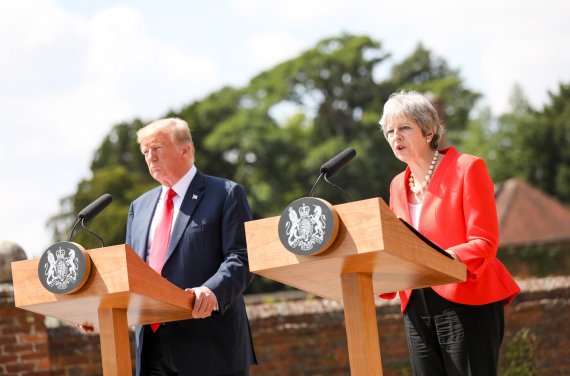 British Prime Minister Theresa May (R) and US President Donald J. Trump (L) attend a joint news conference after their bilateral meeting at Chequers in Aylesbury, Britain, 13 July 2018. US President Trump is on a three-day working visit to the United Kingdom, first trip to the country as US presiden