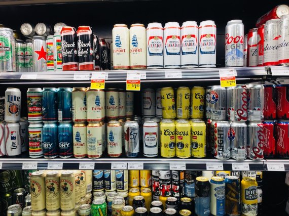 This photo shows Canadian craft brewery beers at a liquor store on August 4, 2018 in Montreal.Canadian craft brewers are facing a sudden aluminum can shortage and are blaming the supply disruptions on aluminum tariffs, making these small businesses among the first casualties of the Canada-US trade s