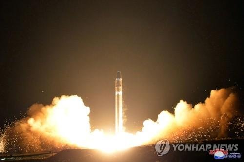 This Nov. 29, 2017, file image provided by the North Korean government shows what the North Korean government calls the Hwasong-15 intercontinental ballistic missile, at an undisclosed location in North Korea. Japan’s Cabinet approved a plan Tuesday, Dec. 19, 2017, to purchase a set of costly land-b