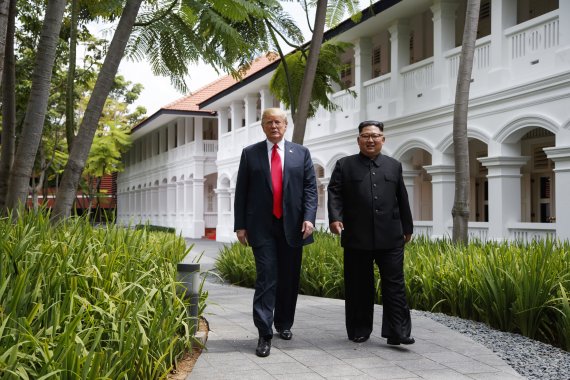 FILE - In this June 12, 2018, file photo, President Donald Trump walks with North Korean leader Kim Jong Un on Sentosa Island in Singapore. In recent weeks it’s become clear that Donald Trump wants to meet with Kim Jong Un again, and the North Korean leader has told the White House he’d like more fa