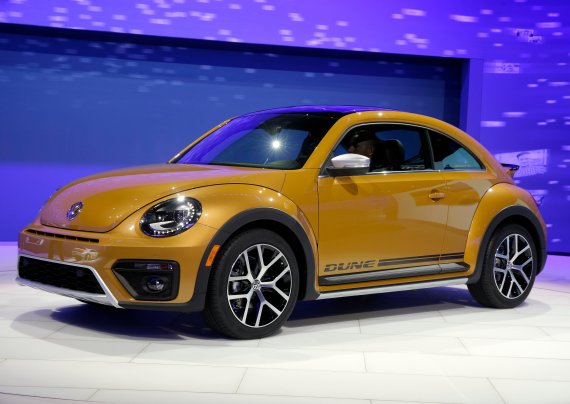 FILE- In this Nov. 18, 2015, file photo the 2017 Volkswagen Beetle Dune is displayed at the Los Angeles Auto Show in Los Angeles. Volkswagen says it will stop making its iconic Beetle in July of next year. Volkswagen of America on Thursday, Sept. 13, 2018, announced the end of production of the thir