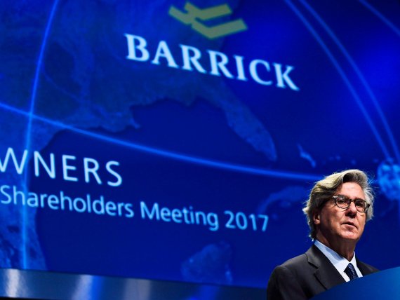 In this April 25, 2017 photo, Barrick Gold executive chairman of the board John L. Thornton speaks during the company's annual general meeting in Toronto. Barrick Gold has agreed to buy Randgold Resources for $6.1 billion in stock to create the world's largest gold miner, worth a combined $18 billio