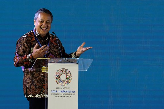 Bank Indonesia Governor Perry Warjiyo speaks during a seminar at the International Monetary Fund - World Bank Group Annual Meeting 2018 in Nusa Dua, Bali, Indonesia October 14, 2018 in this photo taken by Antara Foto. Antara Foto/Puspa Perwitasari/ via REUTERS ATTENTION EDITORS - THIS IMAGE WAS PROV