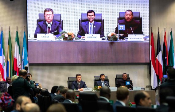 (LtoR) Russian Minister of Energy of Russia Alexander Novak, Organization of the Petroleum Exporting Countries' (OPEC) President UAE Energy Minister Suhail al-Mazroueiand OPEC Secretary General Mohammed Sanusi Barkindo of Nigeria speak during a ministerial level meeting during with OPEC members and 