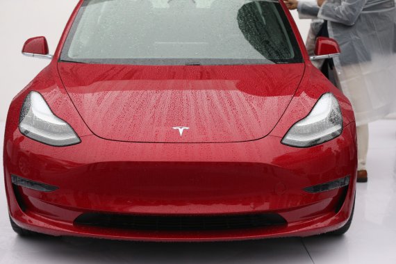 (190107) -- SHANGHAI, Jan. 7, 2019 (Xinhua) -- A Tesla Model 3 is displayed at the groundbreaking ceremony of Tesla Shanghai Gigafactory in Shanghai, east China, Jan. 7, 2019. It is designed with an annual capacity of 500,000 electric cars. Tesla signed the agreement with the Shanghai municipal gove
