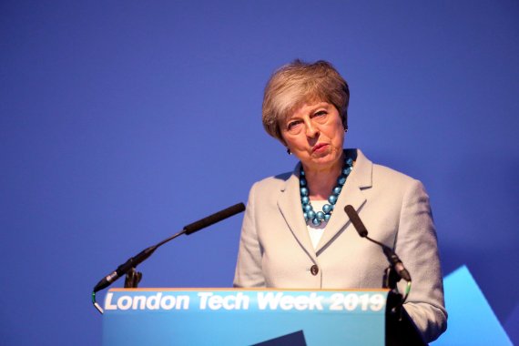 Britain's Prime Minister Theresa May talks at London Tech Week in London, Monday, June 10, 2019. Nominations close Monday in the Brexit-dominated race to become Britain's next prime minister, a contest that will be decided by lawmakers and members of the governing Conservative Party. (Alex Lentati/P