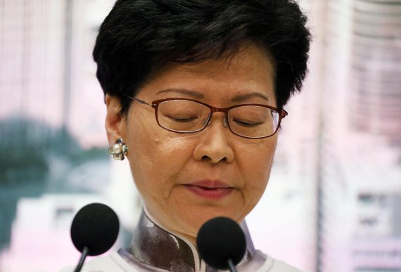 Hong Kong Chief Executive Carrie Lam looks down during a news conference in Hong Kong, China, June 15, 2019. REUTERS/Athit Perawongmetha TPX IMAGES OF THE DAY