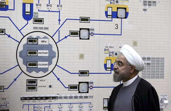 FILE - In this Jan. 13, 2015, file photo released by the Iranian President's Office, President Hassan Rouhani visits the Bushehr nuclear power plant just outside of Bushehr, Iran. Iran announced Sunday, July 7, 2019 it will raise its enrichment of uranium, breaking another limit of its faltering 201