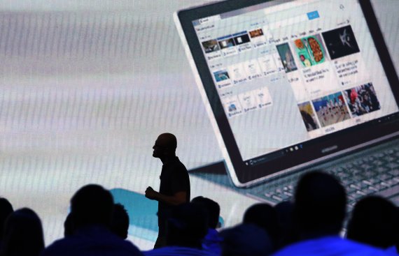 FILE - In this May 6, 2019, file photo Microsoft CEO Satya Nadella walks past audience members as he delivers the keynote address at Build, the company's annual conference for software developers in Seattle. Microsoft says it has detected more than 740 infiltration attempts by nation-state actors in