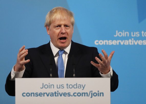 Boris Johnson speaks after being announced as the new leader of the Conservative Party in London, Tuesday, July 23, 2019. Brexit champion Boris Johnson won the contest to lead Britain's governing Conservative Party on Tuesday, and will become the country's next prime minister. (AP Photo/Frank Augste