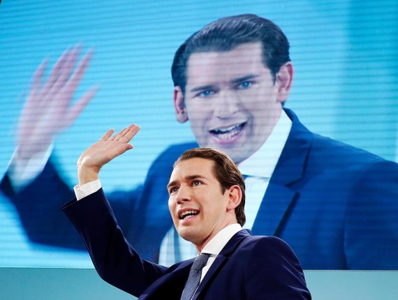 Former Austrian chancellor and top candidate of the Austrian People's Party, OEVP, Sebastian Kurz waves to his supporters in Vienna, Austria, Sunday, Sept. 29, 2019. (AP Photo/Matthias Schrader)