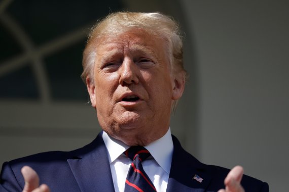 President Donald Trump speaks while greeting Finnish President Sauli Niinisto on the South Portico of the White House, Wednesday, Oct. 2, 2019, in Washington. (AP Photo/Evan Vucci)