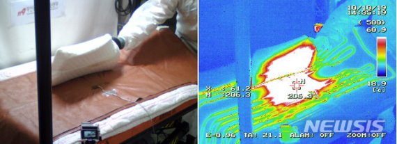 【부산=뉴시스】 부산소방재난본부는 10일 오후 부산 연제구 본부 내 화재조사시험분석실에서 겨울철 사용 빈도가 높은 전기장판에 대한 화재 재현 실험을 실시했다고 밝혔다.사진은 작동 중인 전기장판 위에 둔 라텍스 재질의 메모리폼 베개의 온도 변화를 보여주는 실험 모습. 2019.10.10. (사진=부산소방재난본부 제공)photo@newsis.com