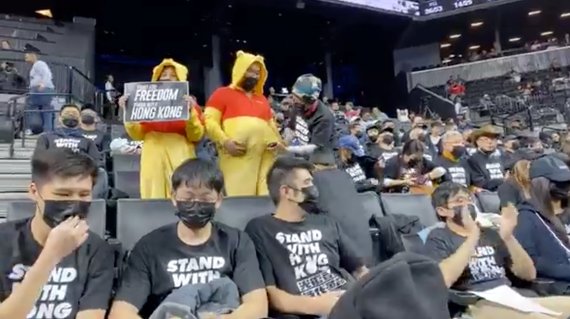 Pro-democracy protesters supporting Hong Kong are seen on the stands of Barclays Center during a game between the Brooklyn Nets and Toronto Raptors, in New York City, New York, U.S., October 18, 2019 in this still image obtained from social media video on October 19, 2019. NY4HK - New Yorkers Suppor