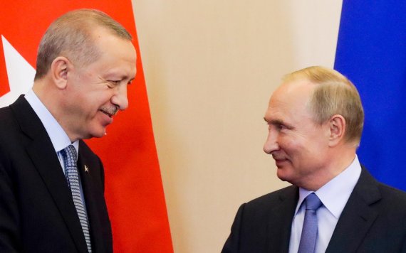 Turkish President Recep Tayyip Erdogan, left, and Russian President Vladimir Putin look at each other during a joint press conference with following their talks in the Bocharov Ruchei residence in the Black Sea resort of Sochi, Russia, Tuesday, Oct. 22, 2019. Erdogan says Turkey and Russia have reac
