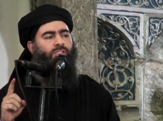 FILE - This file image made from video posted on a militant website Saturday, July 5, 2014, purports to show the leader of the Islamic State group, Abu Bakr al-Baghdadi, delivering a sermon at a mosque in Iraq during his first public appearance. The leader of the Islamic State militant network is be