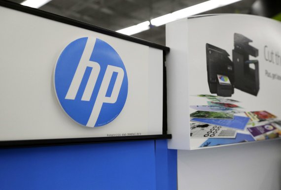FILE - In this May 24, 2016, file photo, Hewlett-Packard products are on display at a store in North Andover, Mass. Computer and printer maker HP Inc. said Wednesday, Nov. 6, 2019, that it has received a 'proposal' from copier maker Xerox and has had conversations 'from time to time' with the compan