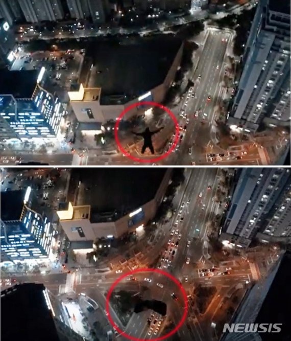 【부산=뉴시스】 부산 해운대경찰서는 고층건물에서 두 차례에 걸쳐 낙하산을 타고 뛰어내린 남성들에 대해 수사를 벌이고 있다고 12일 밝혔다. 사진은 남성들이 고층건물 옥상에서 뛰어내리는 모습이 담긴 유튜브 영상. (사진=유튜브 캡처).2019.11.12.photo@newsis.com /사진=뉴시스