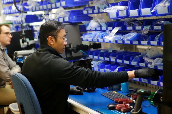 An employee works on final assembly of VOCSN Multi-Function Ventilators, which integrate five separate medical devices, at Ventec Life Systems, a ventilator manufacturer that has seen a large increase in demand since the global coronavirus disease (COVID-19) outbreak began, in Bothell, Washington, U