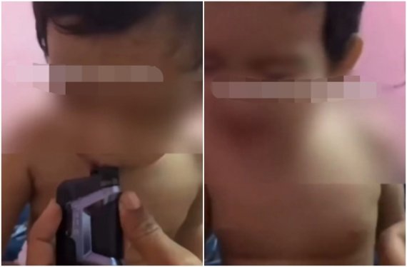 전자담배를 억지로 물게 된 두살배기 말레이시아 아이. 페이스북 캡처