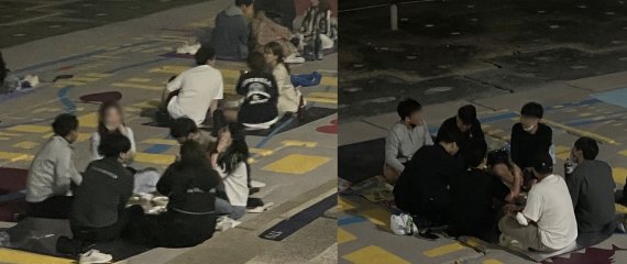 부산 수영구 민락수변공원에서 입장객들이 5인 이상 모여 앉아 있다.2021.6.5/ © 뉴스1 이유진 기자
