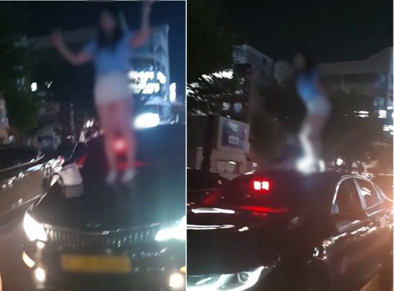 울산만취녀가 택시 위에서 난동을 피우는 모습. /사진=뉴시스