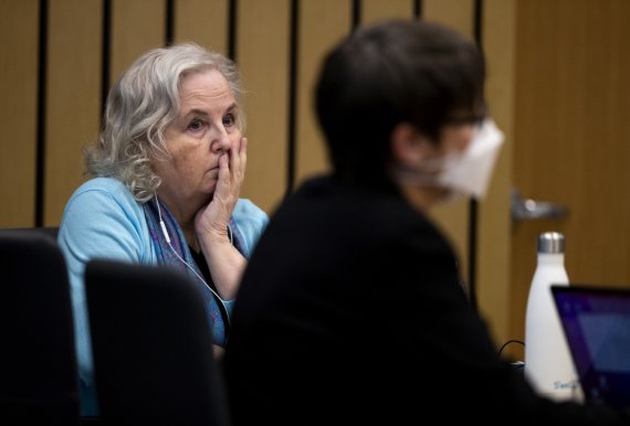 FILE - Romance writer Nancy Crampton Brophy, left, accused of killing her husband, Dan Brophy, in June 2018, watches proceedings in court in Portland, Ore., on April 4, 2022. She was sentenced Monday, June 13, 2022, to life in prison with the possibility of parole for murdering her husband. (Dave Ki