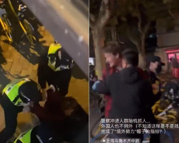 27일 중국 상하이에서 영국 BBC의 에드 로런스 기자가 시위 취재중 경찰에 의해 연행되고 있다.연합뉴스