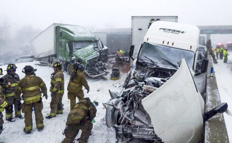 epa10377715 A handout photo made available by the Ohio Highway Patrol shows rescuers at the scene of a multi-vehicle crash in which four people died and left multiple people injured on the Ohio Turnpike in Erie County, Ohio, USA, 23 December 2022 (issued 24 December 2022.) Much of the US is under a 