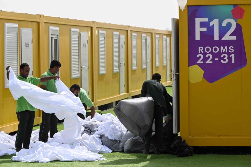 (FILES) In this file photo taken on November 9, 2022 employees prepare cabins at the Al-Emadi fan village in Doha ahead of the Qatar 2022 FIFA World Cup football tournament. - Qatar will send Turkey and Syria 10,000 cabins and caravans used during the World Cup, which would now house people who lost