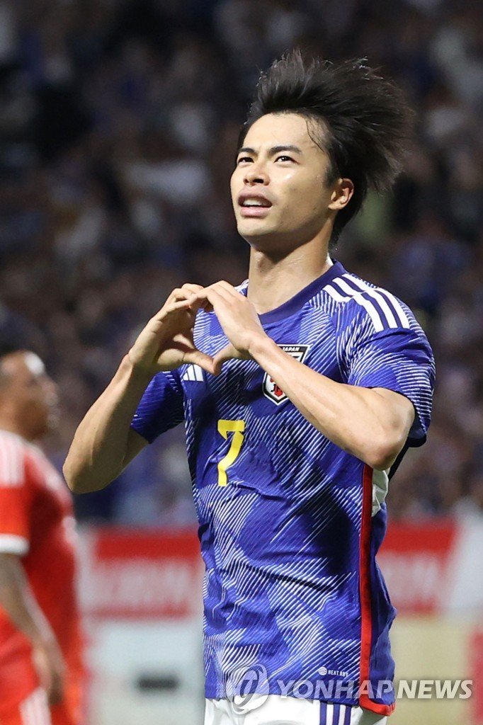 미토마 가오루 Japan's Kaoru Mitoma gestures as he celebrates after scoring a goal during the friendly football match between Japan and Peru at Suita City Stadium in the city of Suita, Osaka prefecture on June 20, 2023. (Photo by JIJI Press / AFP) / Japan OUT