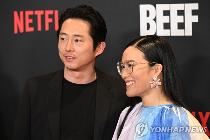 (FILES) Actors and executive producers Steven Yeun and Ali Wong arrive for the Los Angeles premiere of Netflix's Beef at the Tudum Screening Room in Los Angeles, California, on March 30, 2023. Can any TV show topple "Succession" at the Emmys? Will Amazon's lavish "Lord of the Rings" rule them all? A
