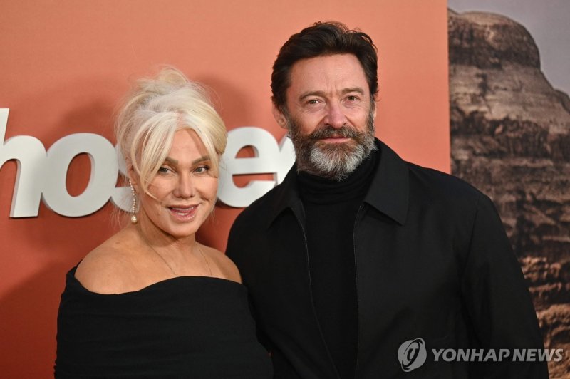 (FILES) Australian actress Deborra-Lee Furness (L) and Australian actor Hugh Jackman arrive for the "Ghosted" premiere at AMC Lincoln Square Theater in New York City on April 18, 2023. September 15, the Australian couple, who have two children, Oscar, 23, and Ava, 18, have been married for 27 years 