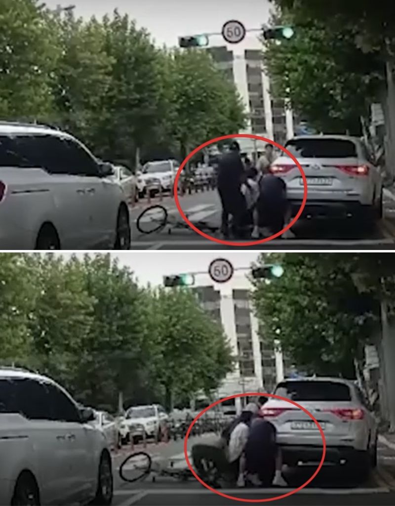 SUV차량에 뒷바퀴에 팔이 깔린 고령의 남성을 보고 시민들이 달려와 차를 들어 올리고 있다./사진=YTN