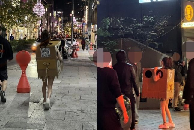 서울 압구정동 거리에서 박스만 걸친 채 길거리를 돌아다니는 한 여성이 포착돼 관심이 쏠리고 있다.사진=온라인 커뮤니티.