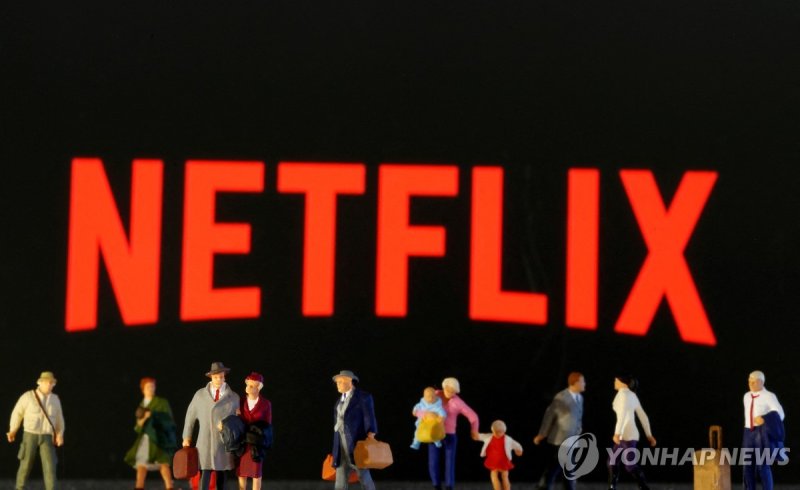 FILE PHOTO: Small toy figures are seen in front of diplayed Netflix logo in this illustration taken March 19, 2020. REUTERS/Dado Ruvic/Illustration/File Photo
