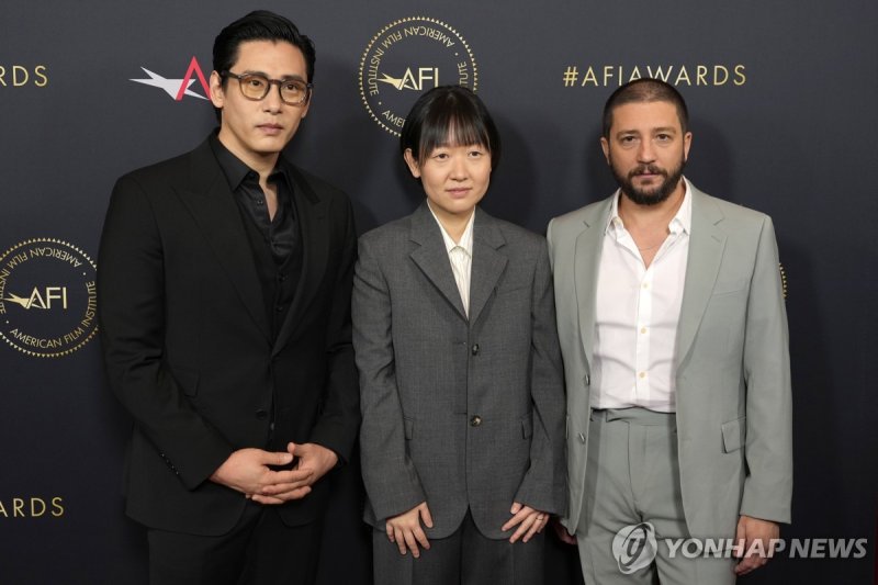 Teo Yoo, from left,Celine Song, and John Magaro arrive at the AFI Awards on Friday, Jan. 12, 2024, at the Four Seasons Beverly Hills in Beverly Hills, Calif. (AP Photo/Chris Pizzello) 011224130016, 21334631,