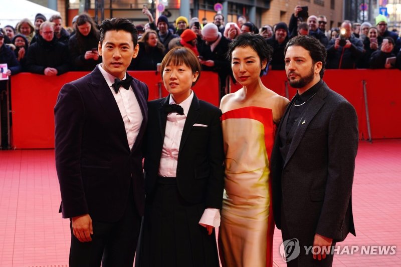 epa10477571 (L-R) South Korean actor Teo Yoo, Korean-Canadian director Celine Song, US actor Greta Lee, and US actor John Magaro arrive for the premiere of the movie 'Past Lives' during the 73rd Berlin International Film Festival 'Berlinale' in Berlin, Germany, 19 February 2023. The in-person event 