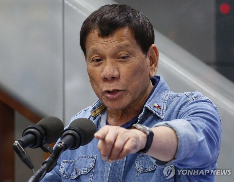 FILE - Philippine President Rodrigo Duterte addresses the Filipino Overseas Workers, Feb. 13, 2018, at the Ninoy Aquino International Airport in suburban Pasay city, southeast of Manila, Philippines. His daughter, Sara Duterte, said Tuesday, June 25, 2024, that the former president and her two broth