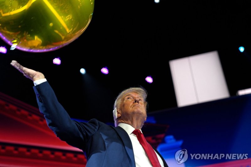 Former US President and 2024 Republican presidential candidate Donald Trump pushes a balloon after accepting his party's nomination at the end of the last day of the 2024 Republican National Convention at the Fiserv Forum in Milwaukee, Wisconsin, on July 18, 2024. Days after he survived an assassina