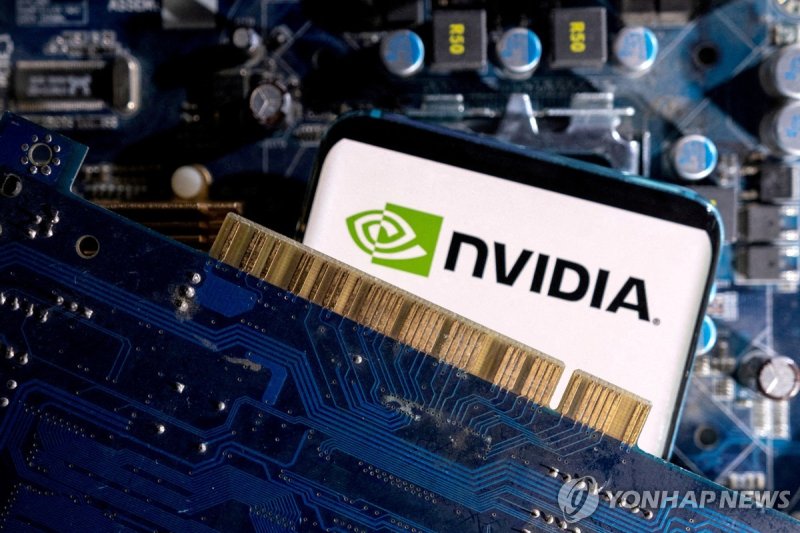 FILE PHOTO: A smartphone with a displayed NVIDIA logo is placed on a computer motherboard in this illustration taken March 6, 2023. REUTERS/Dado Ruvic/Illustration/File Photo/File Photo/File Photo