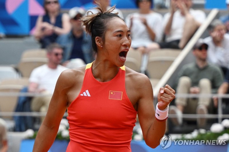 epa11522793 Qinwen Zheng of China celebrates a point during the Women's Singles Gold Medal match against Donna Vekic of Croatia at the Tennis competitions in the Paris 2024 Olympic Games, at the Roland Garros in Paris, France, 03 August 2024. EPA/CAROLINE BLUMBERG