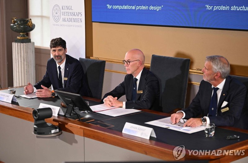 SWEDEN-NOBEL-PRIZE-CHEMISTRY (L-R) Chair of the Nobel Prize Committee for Chemistry Heiner Linke, Secretary General of the Royal Swedish Academy of Sciences Hans Ellegren and Member of the Nobel Prize Committee for Chemistry Johan Aqvist announce the laureates of the 2024 Nobel Prize in Chemistry at