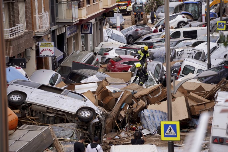 The King of Spain visits the worst flood-affected area and faces angry citizens.